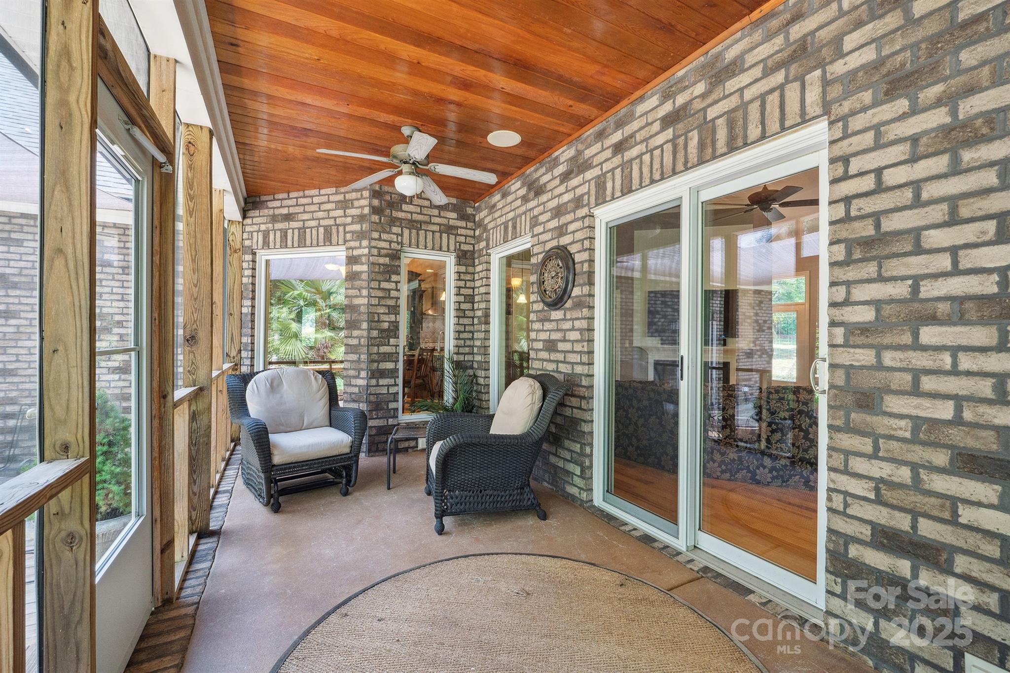 8304 Renee Ford Road Stanfield, NC 28163 - Photo 27 of 30 a balcony with furniture and a table