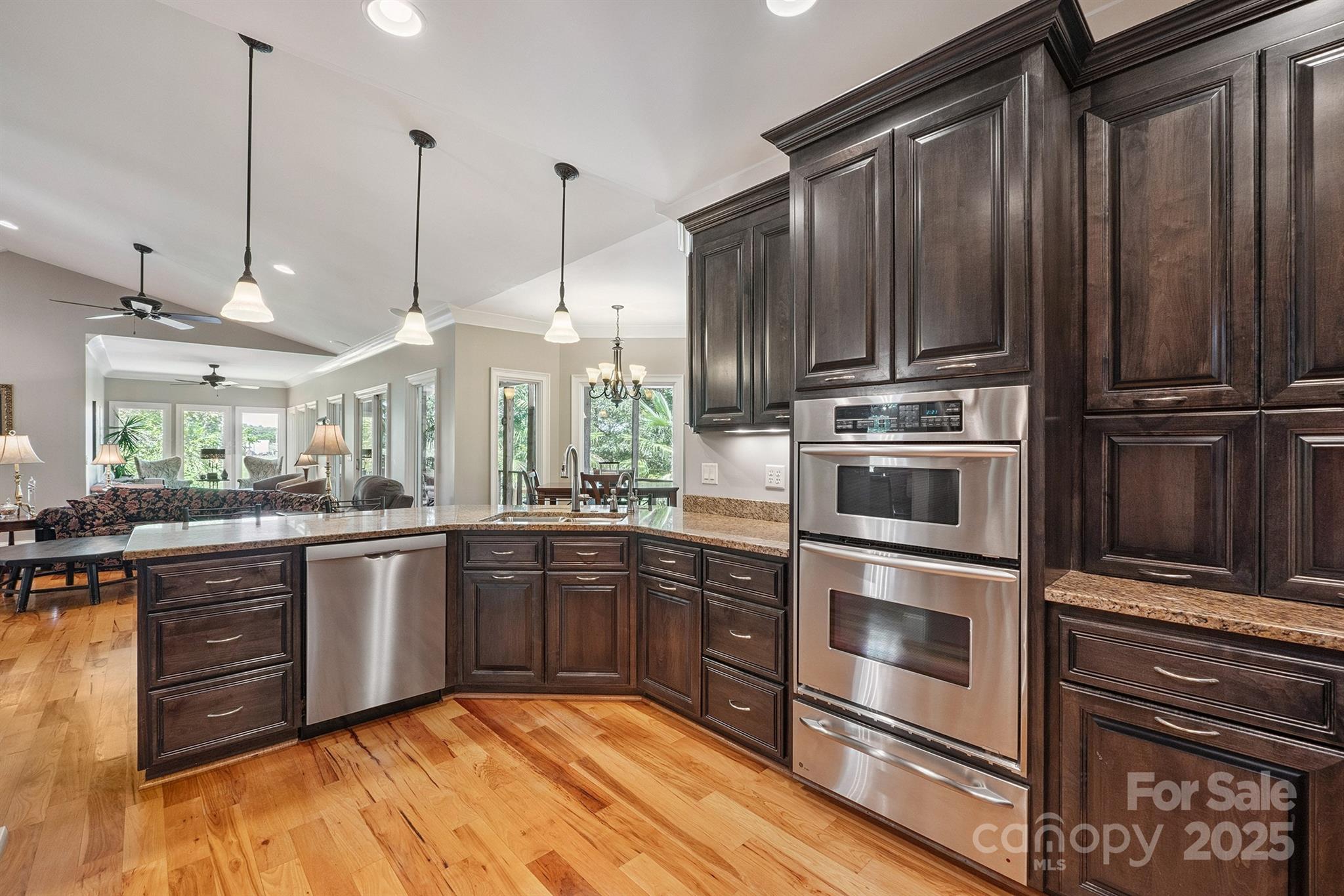 8304 Renee Ford Road Stanfield, NC 28163 - Photo 10 of 30 a kitchen with stainless steel appliances granite countertop a stove a sink and dishwasher