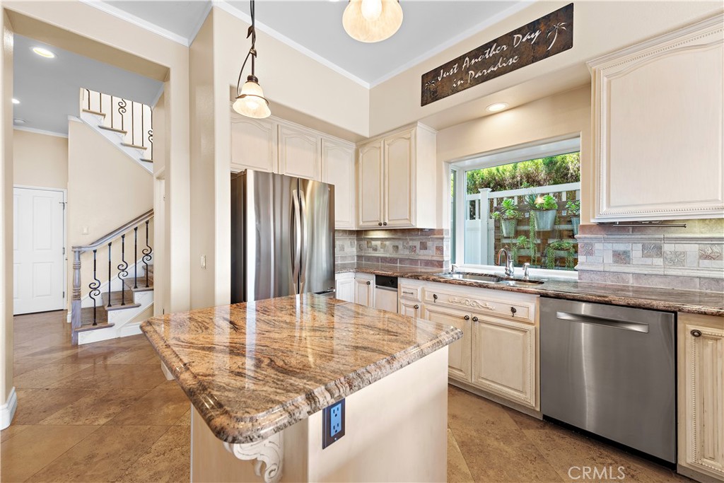 33852 Bridgehampton Drive Dana Point, CA 92629 - Photo 15 of 51 a kitchen with stainless steel appliances granite countertop a sink and a refrigerator