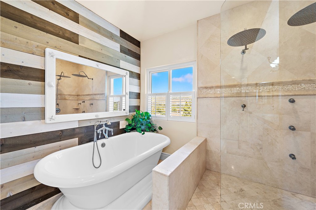 33852 Bridgehampton Drive Dana Point, CA 92629 - Photo 31 of 51 a bathroom with a tub sink and mirror