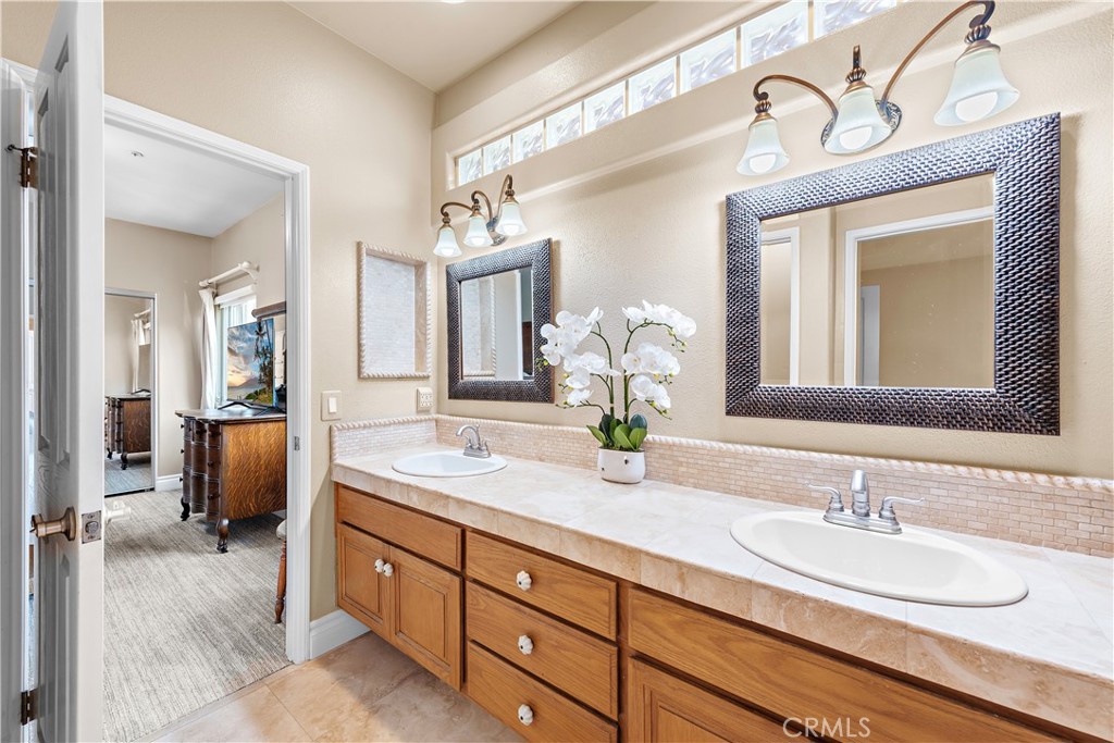 33852 Bridgehampton Drive Dana Point, CA 92629 - Photo 35 of 51 a bathroom with a granite countertop sink double and mirror