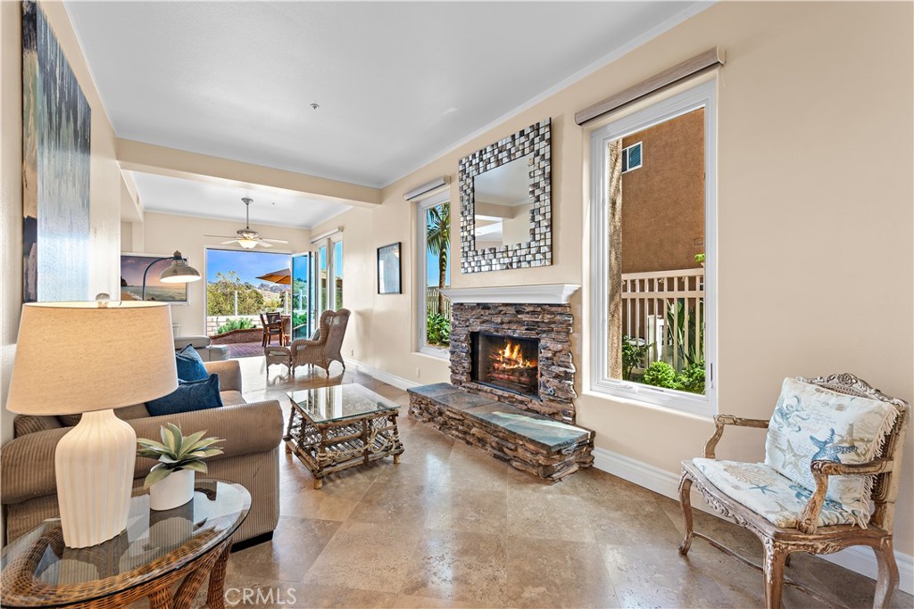 33852 Bridgehampton Drive Dana Point, CA 92629 - Photo 7 of 51 a living room with furniture and a fireplace