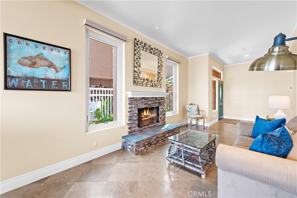 33852 Bridgehampton Drive Dana Point, CA 92629 - Photo 9 of 51 a living room with furniture and a fireplace