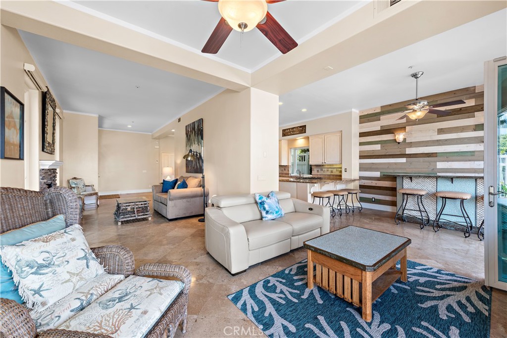 33852 Bridgehampton Drive Dana Point, CA 92629 - Photo 10 of 51 a living room with furniture a rug and a chandelier