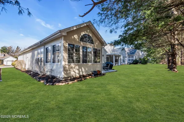 a view of yard with outdoor seating and deck