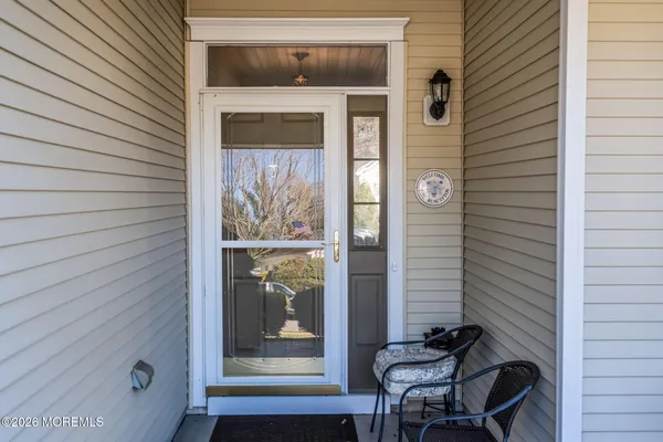 a view of a door and chair in the balcony