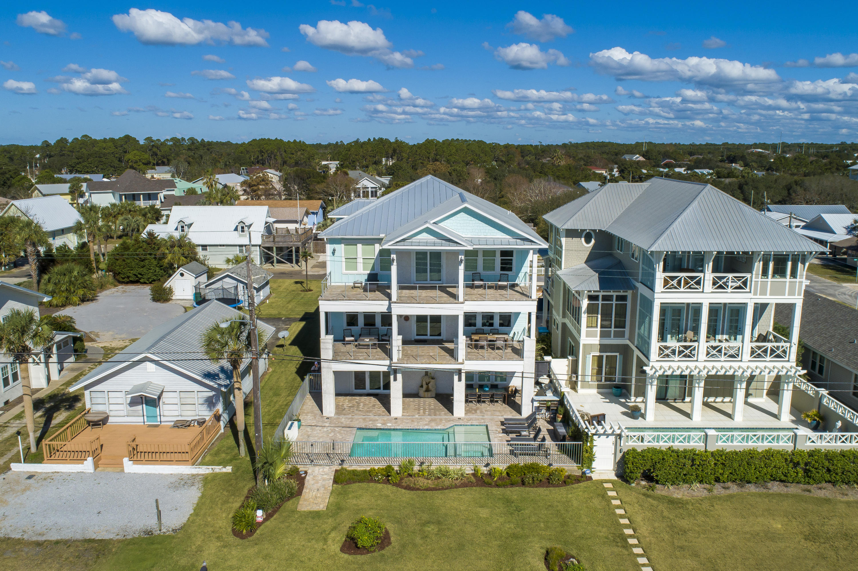 21222 Front Beach Road Panama City Beach, FL 32413 - Photo 1 of 60 an aerial view of residential houses with outdoor space and ocean view