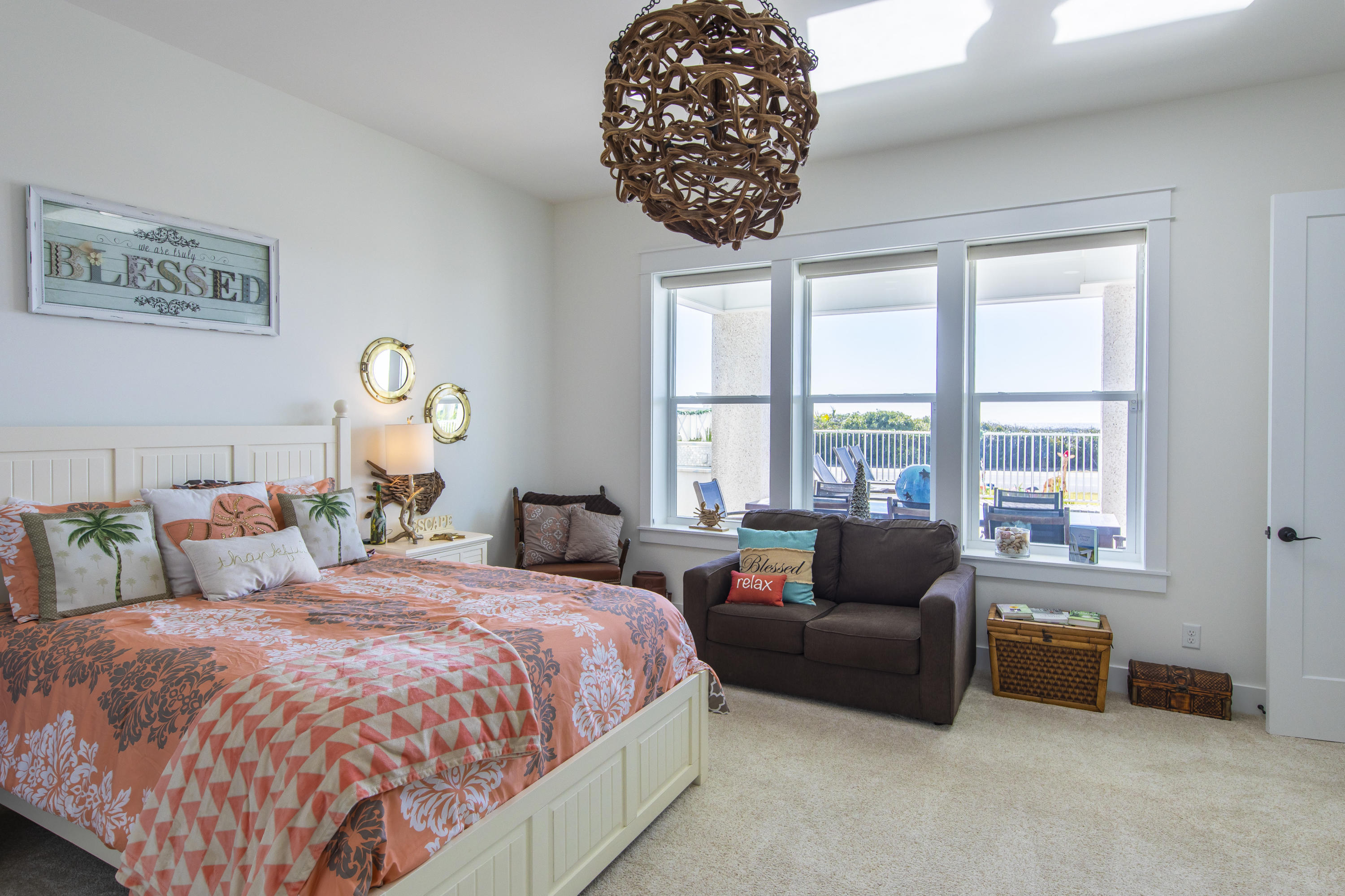 21222 Front Beach Road Panama City Beach, FL 32413 - Photo 13 of 60 a spacious bedroom with a bed and a couch