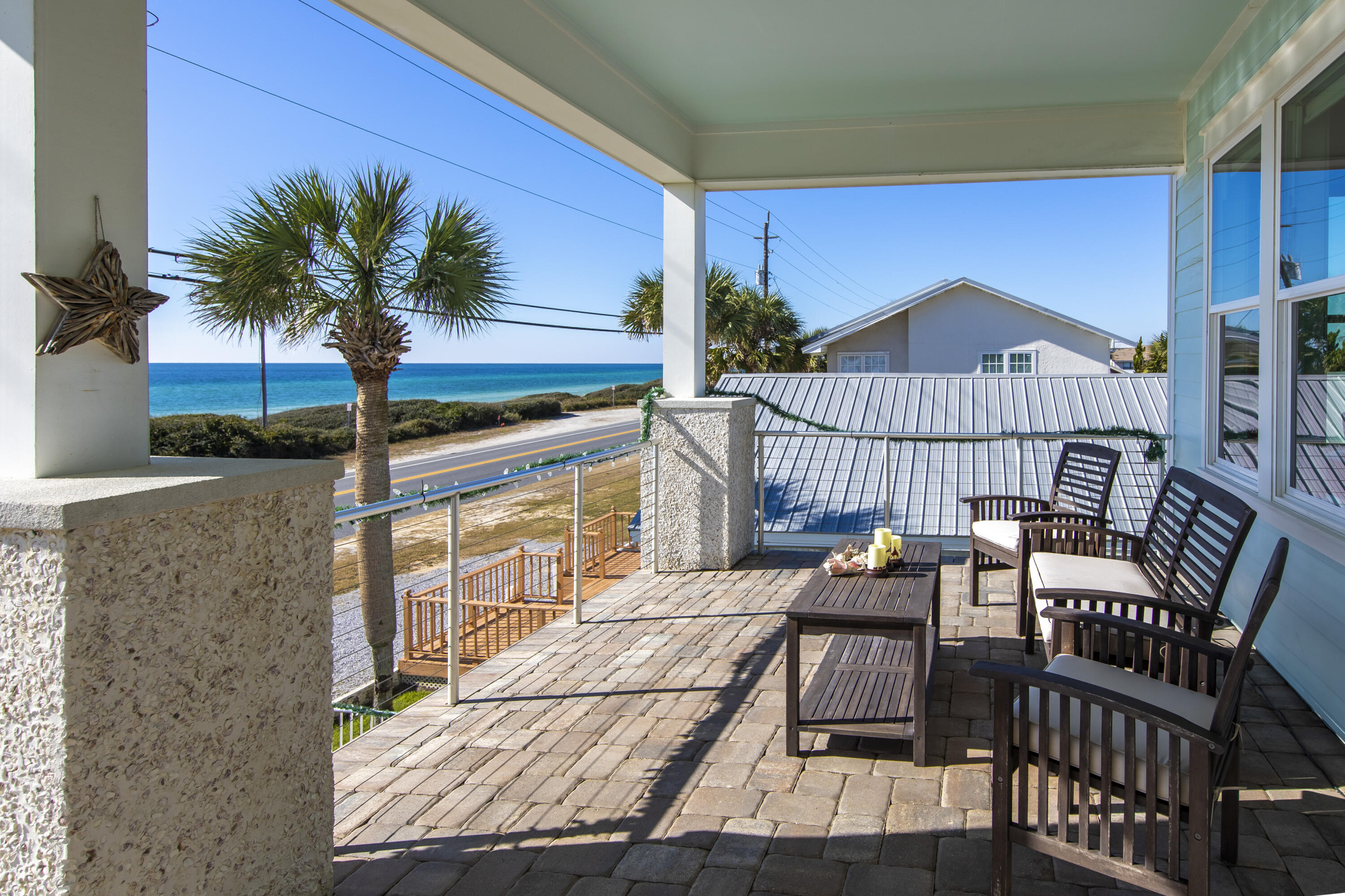 21222 Front Beach Road Panama City Beach, FL 32413 - Photo 20 of 60 a view of a roof deck with furniture