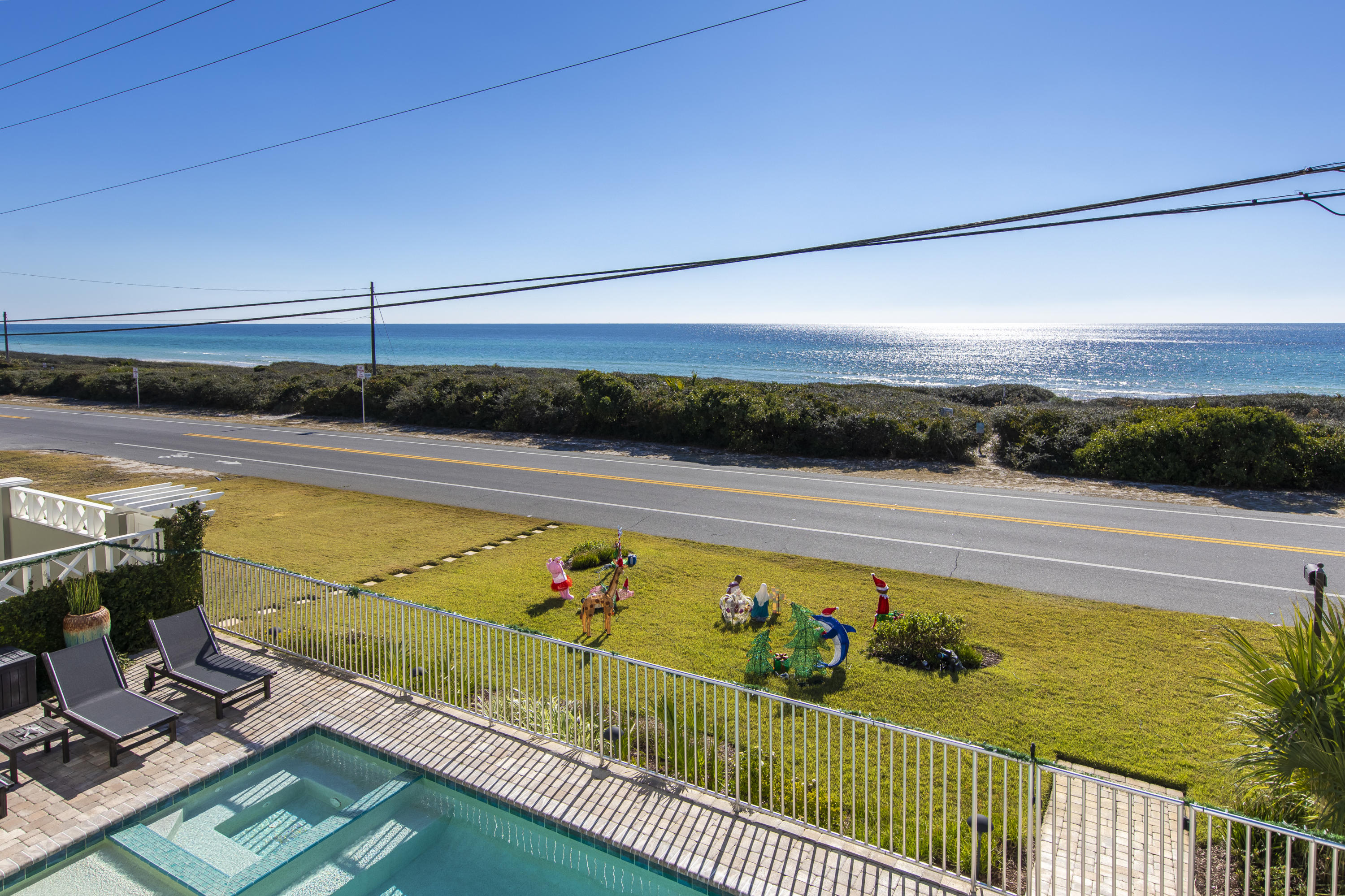 21222 Front Beach Road Panama City Beach, FL 32413 - Photo 22 of 60 a view of a swimming pool and outdoor seating
