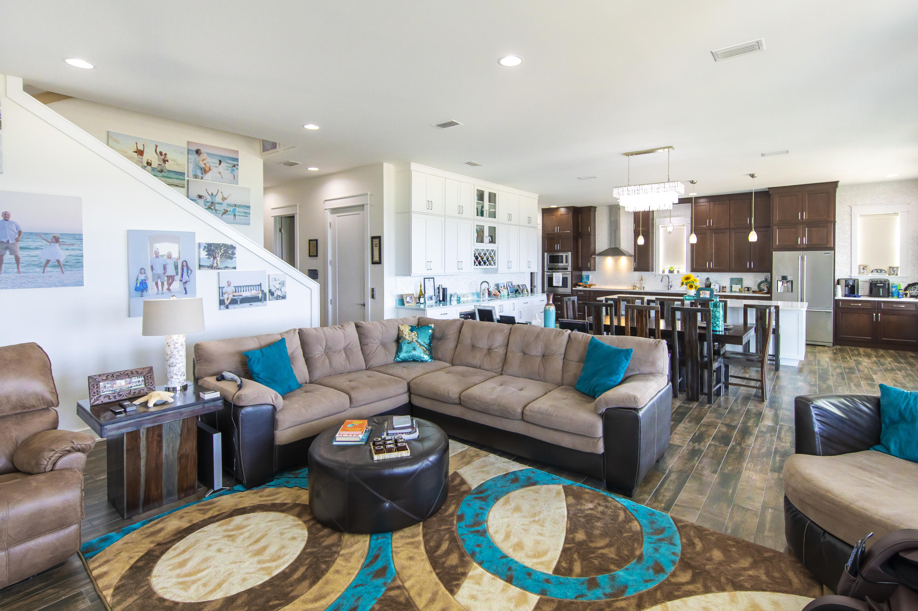 21222 Front Beach Road Panama City Beach, FL 32413 - Photo 26 of 60 a living room with furniture a rug and kitchen view