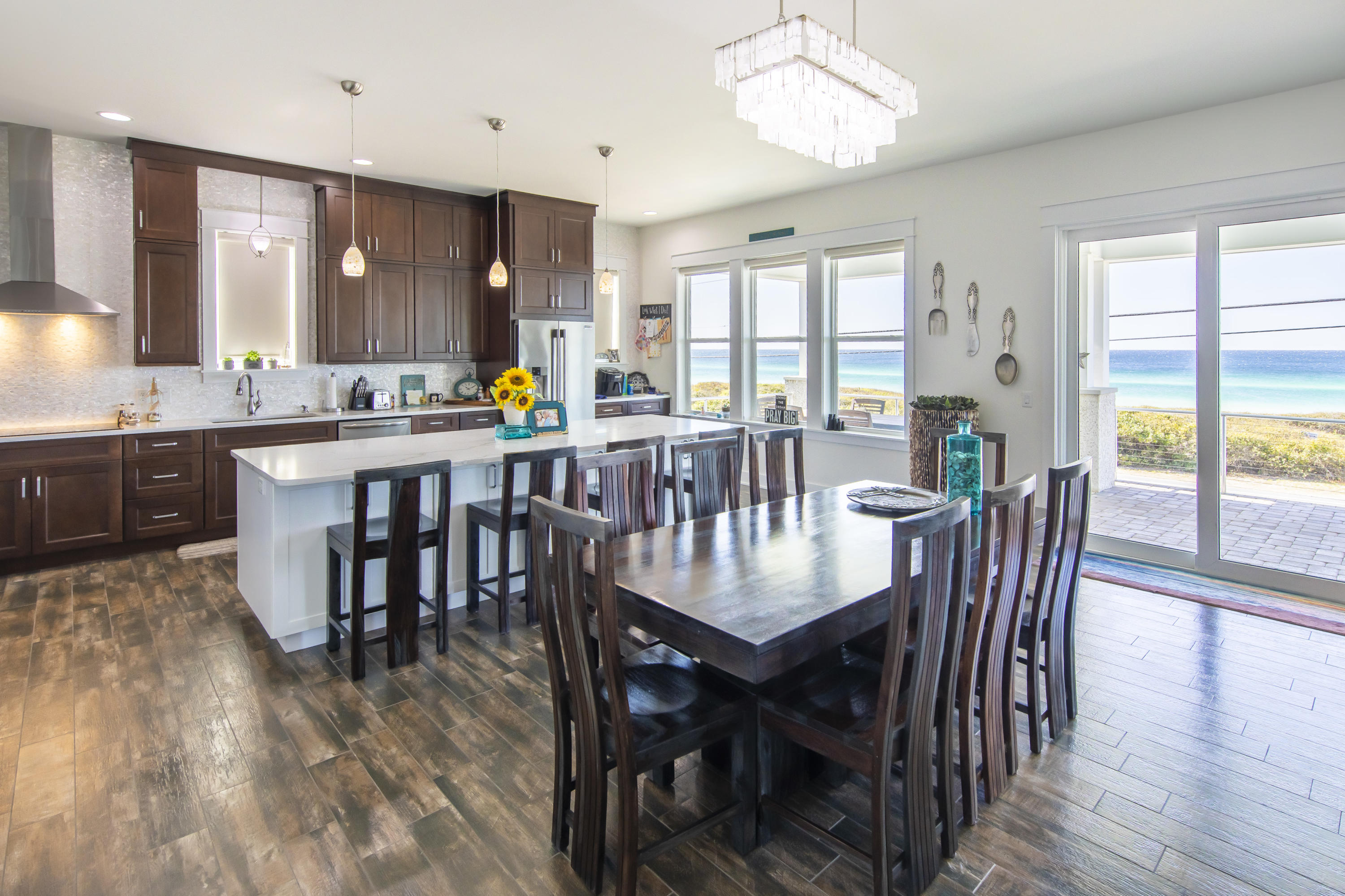 21222 Front Beach Road Panama City Beach, FL 32413 - Photo 29 of 60 a view of a a dining room with furniture window and wooden floor