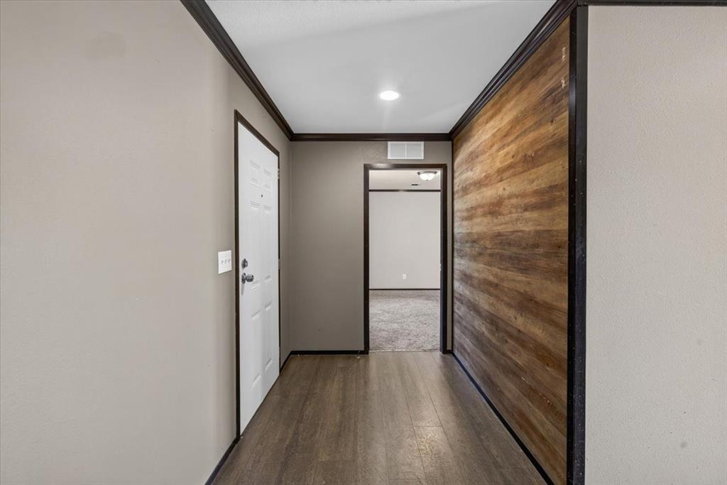 1129 Ragsdale Street Terrell, TX 75160 - Photo 2 of 29 Entry with wood accent on the wall