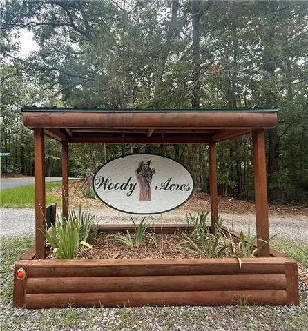 a view of porch with a table and chairs