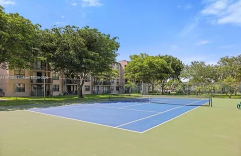 a view of outdoor space and tennis court