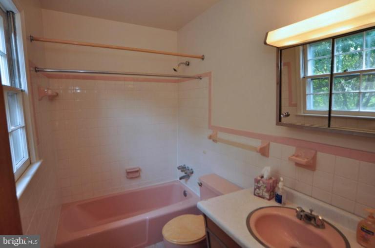13601 Floris Street Herndon, VA 20171 - Photo 13 of 20 a bathroom with a sink toilet and shower