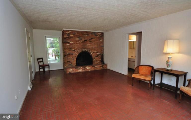 13601 Floris Street Herndon, VA 20171 - Photo 7 of 20 a living room with furniture and a fireplace