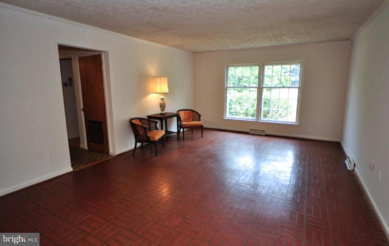 13601 Floris Street Herndon, VA 20171 - Photo 8 of 20 an empty room with wooden floor and windows