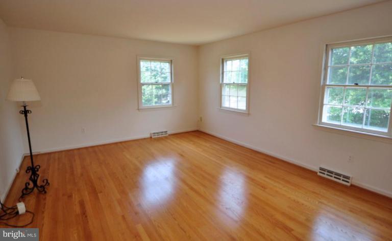 13601 Floris Street Herndon, VA 20171 - Photo 9 of 20 a view of empty room with wooden floor and fan