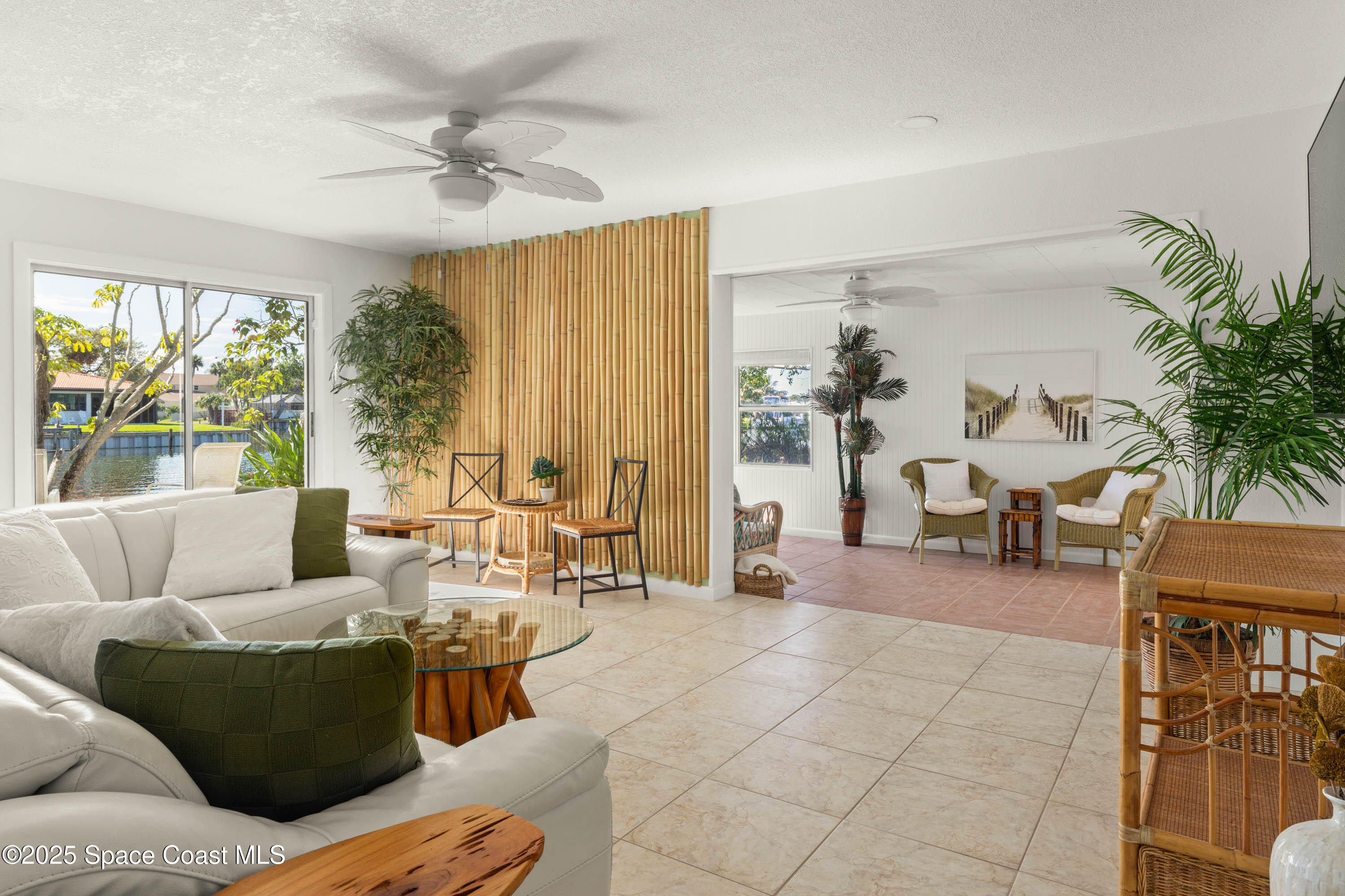 124 Aucila Road Cocoa Beach, FL 32931 - Photo 17 of 58 a living room with furniture and a large window