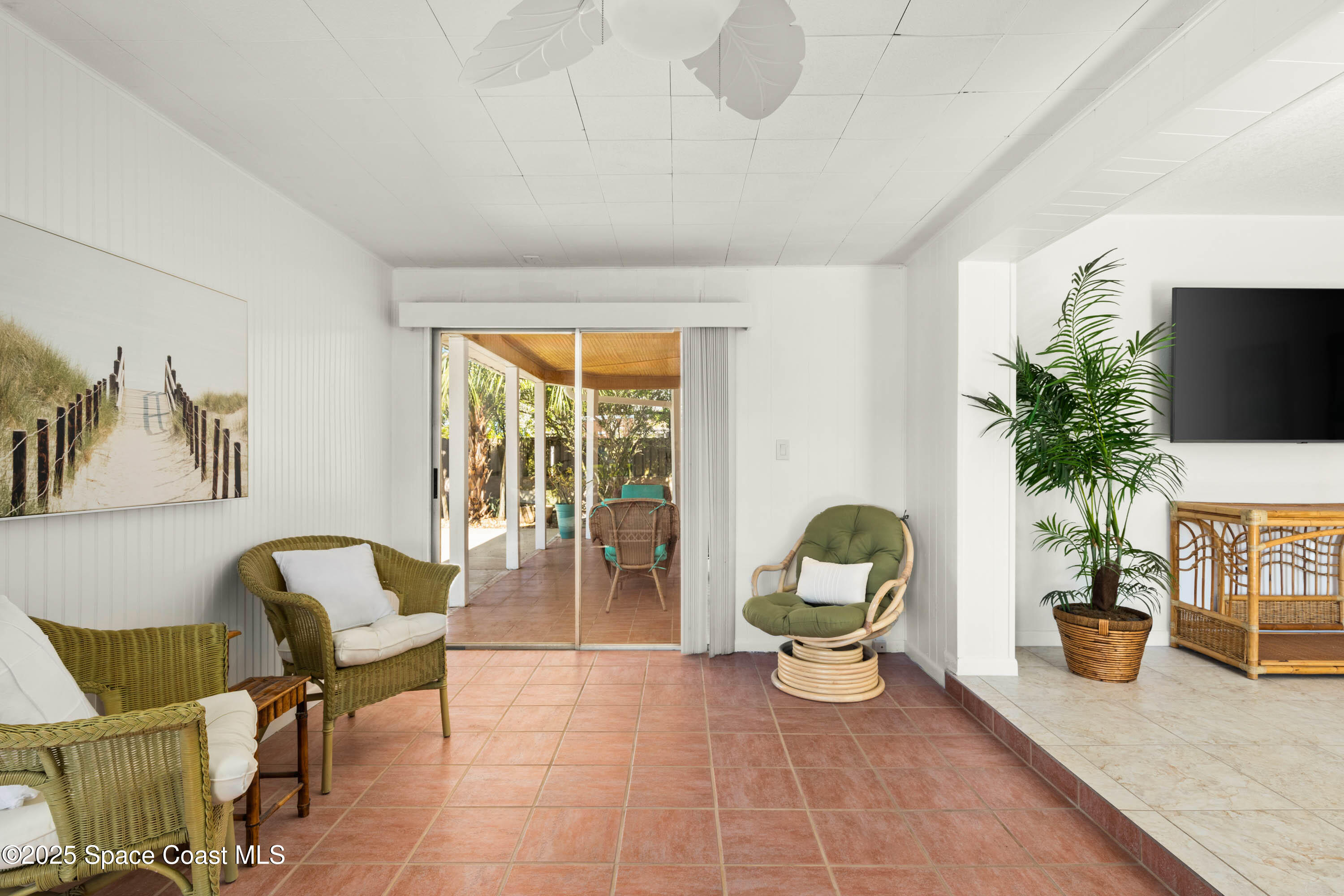 124 Aucila Road Cocoa Beach, FL 32931 - Photo 19 of 58 a living room with furniture and a potted plant
