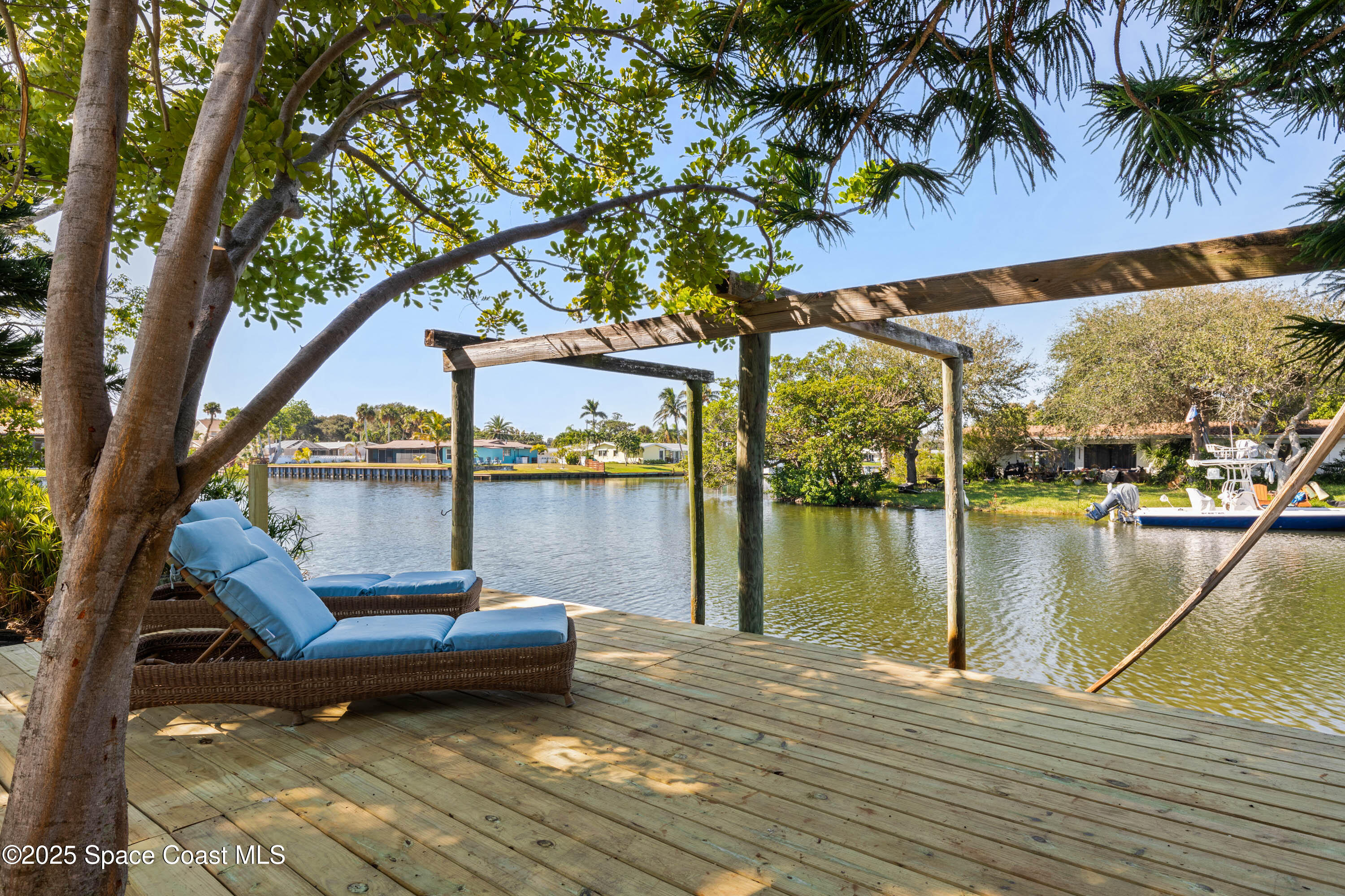 124 Aucila Road Cocoa Beach, FL 32931 - Photo 25 of 58 a view of a lake from a roof deck