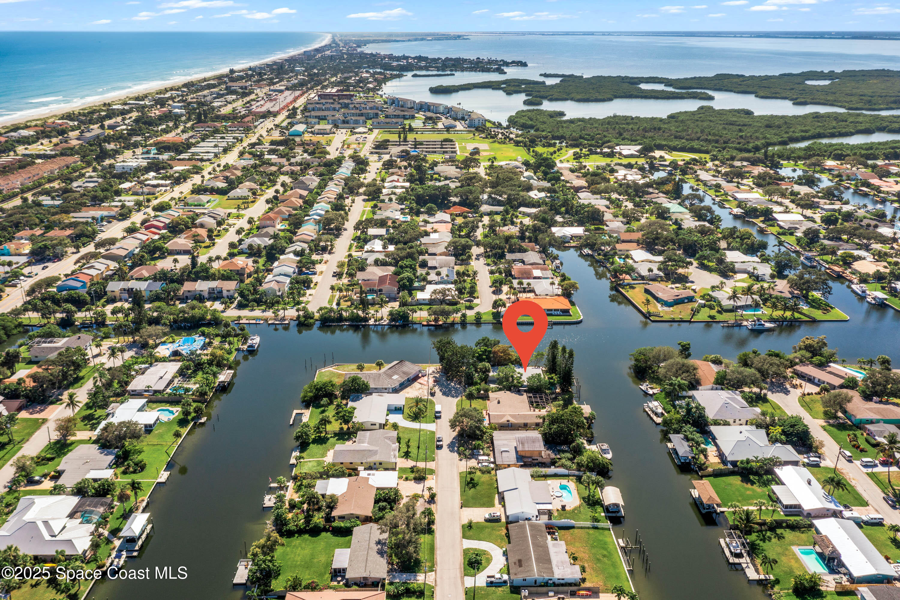 124 Aucila Road Cocoa Beach, FL 32931 - Photo 27 of 58 an aerial view of residential houses with outdoor space