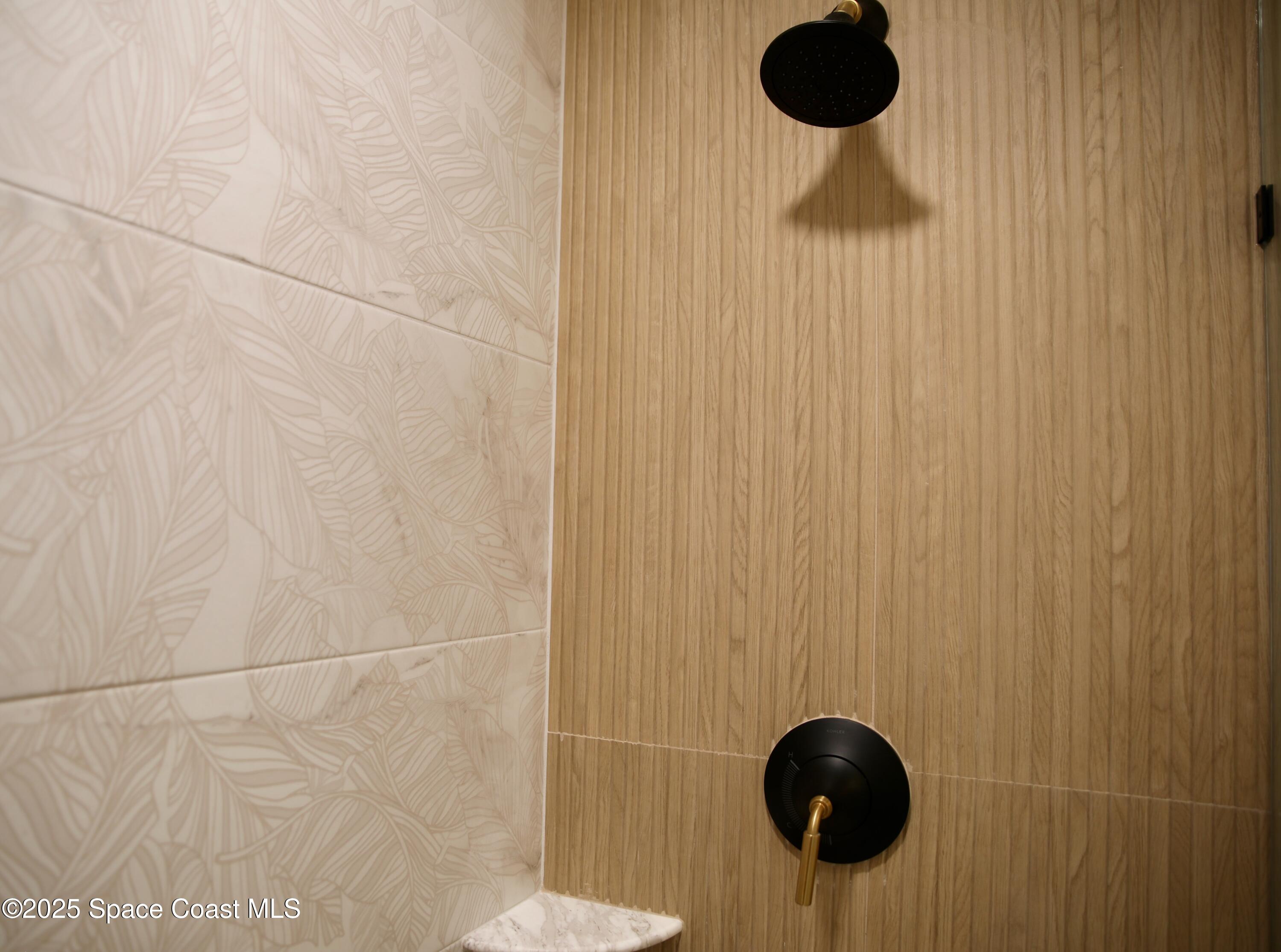 124 Aucila Road Cocoa Beach, FL 32931 - Photo 39 of 58 a bathroom with a shower