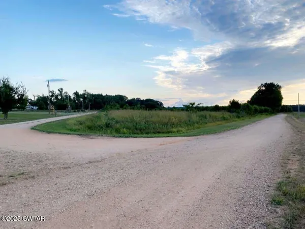 a view of a field with a big yard