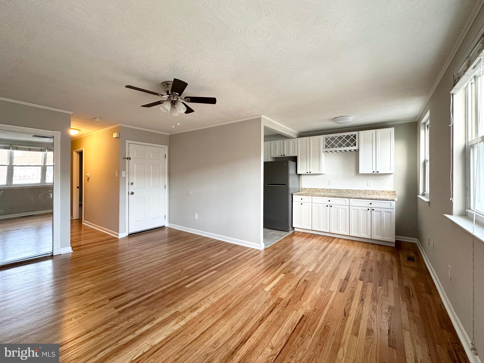 3746 Genesee Drive Philadelphia, PA 19154 - Photo 7 of 21 a view of a kitchen with wooden floor and a ceiling fan