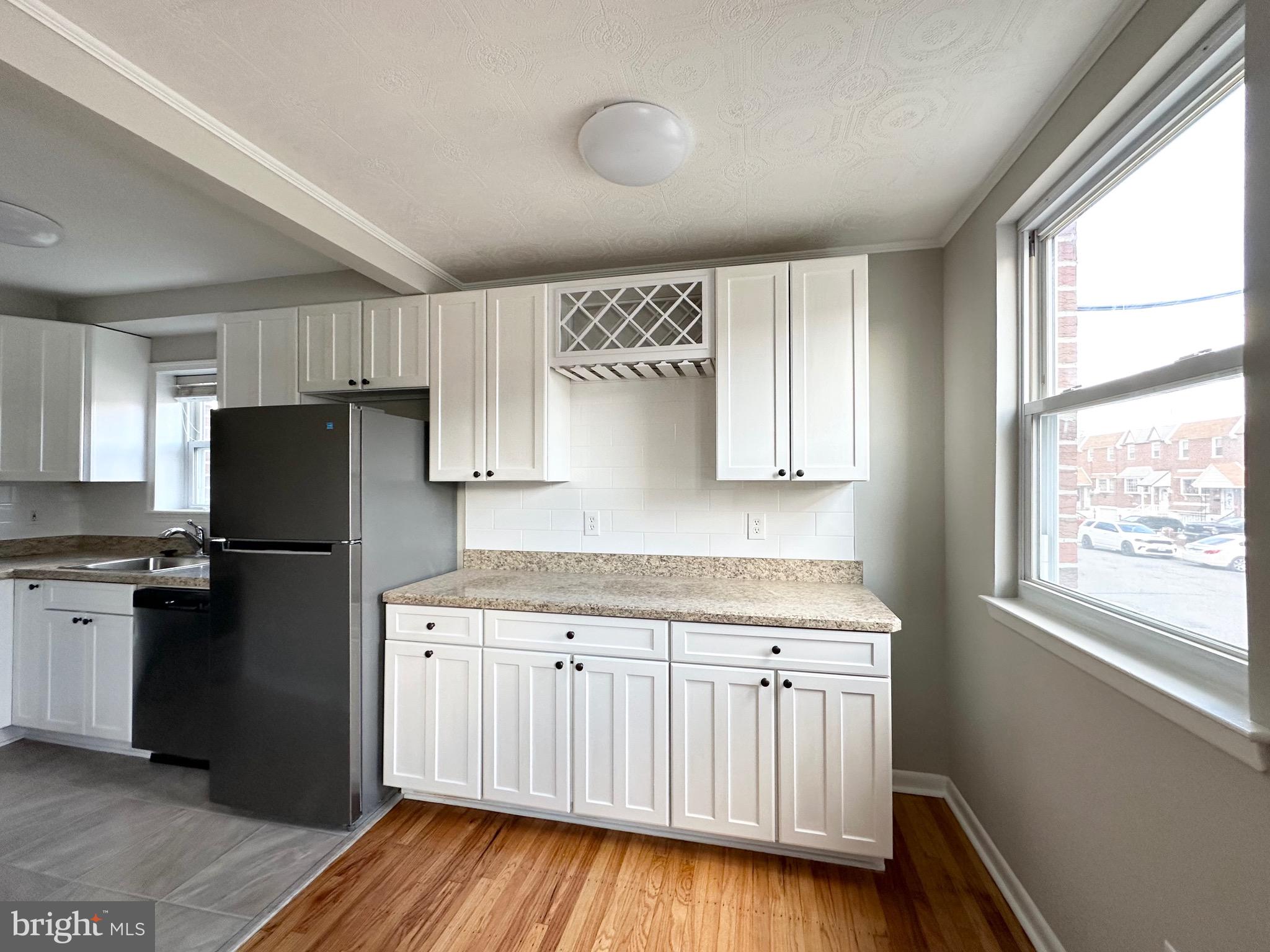 3746 Genesee Drive Philadelphia, PA 19154 - Photo 8 of 21 a kitchen with a refrigerator a sink and dishwasher with wooden floor