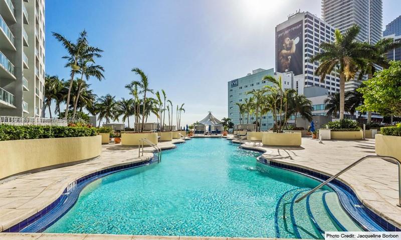 Miami Central Business District Miami, FL 33132 - Photo 2 of 17 a view of swimming pool with outdoor seating and plants