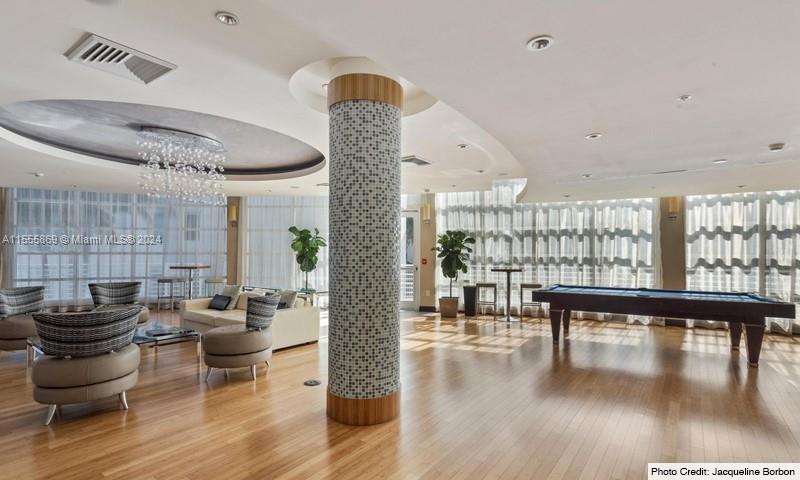 Miami Central Business District Miami, FL 33132 - Photo 3 of 17 a living room with furniture and wooden floor