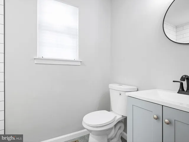 a bathroom with a toilet and a sink