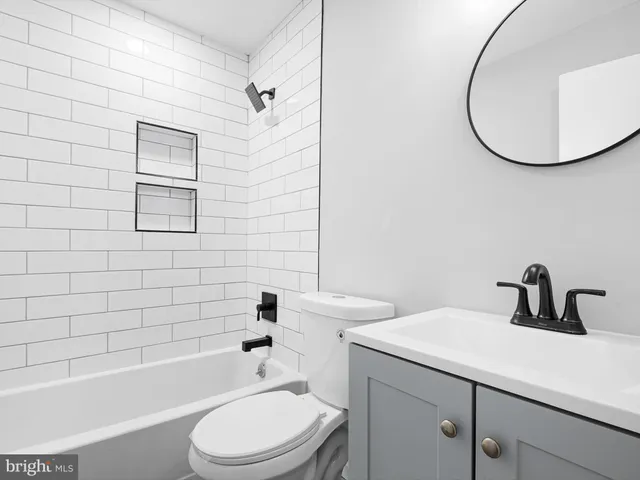 a bathroom with a sink a toilet and a bathtub