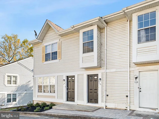 a view of a house with a window and balcony