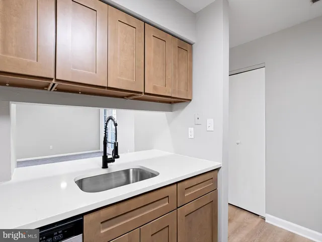 a close view of sink and cabinets