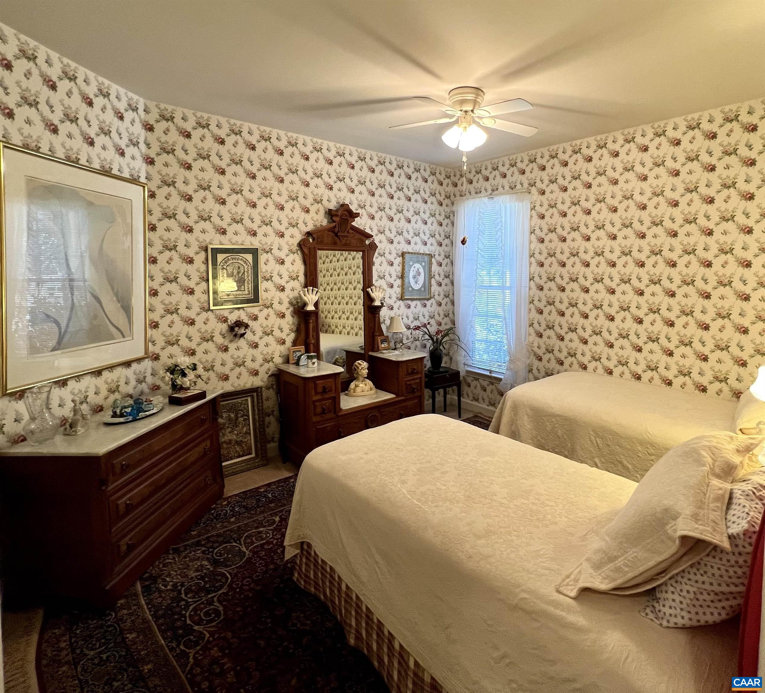 2118 Shepherds Ridge Road Charlottesville, VA 22901 - Photo 21 of 27 a bedroom with double bed and a chandelier