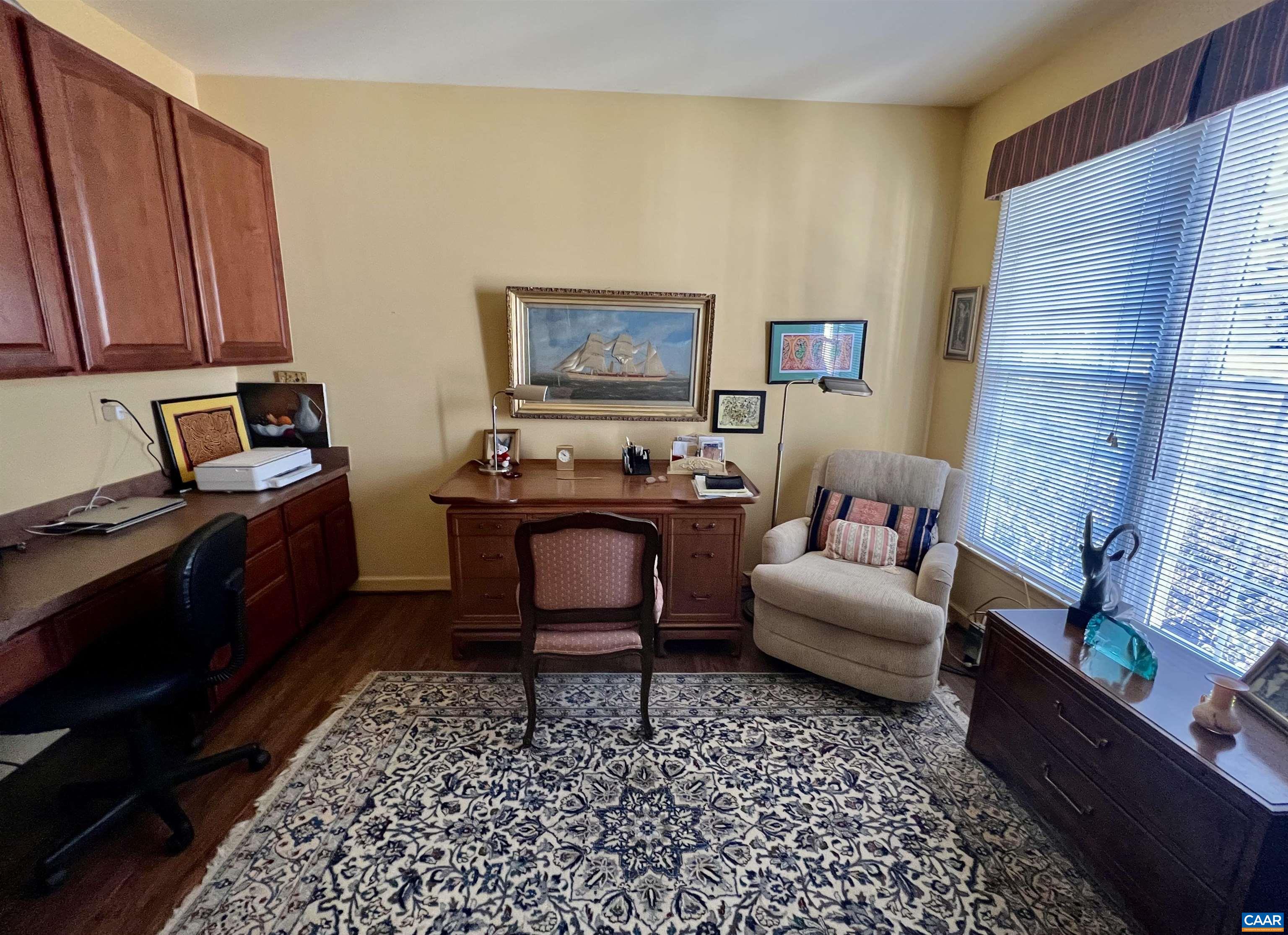 2118 Shepherds Ridge Road Charlottesville, VA 22901 - Photo 10 of 27 a living room with furniture and a rug
