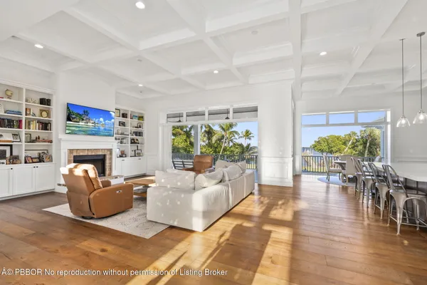 a large kitchen with lots of counter space a sink appliances and dining table