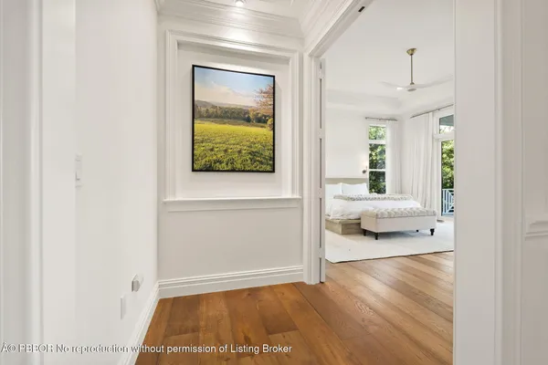 a spacious bathroom with a double vanity sink a mirror and a bathtub
