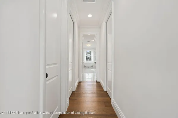 a bedroom with a bed couch and a window