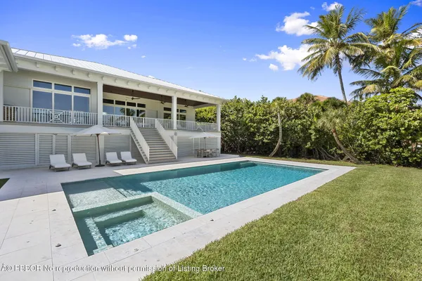 a table and chairs in front of a house