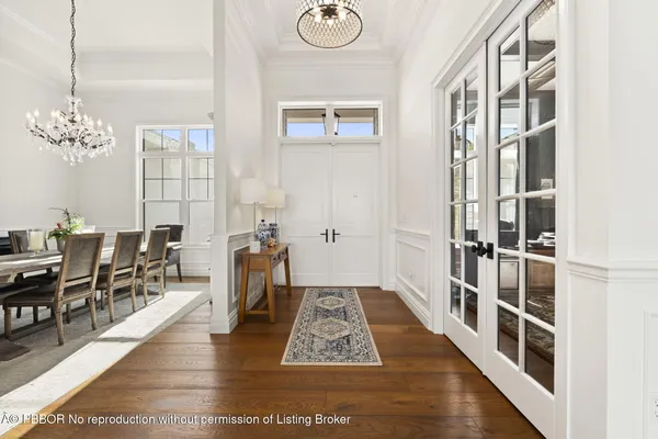 a living room with furniture large window and fireplace