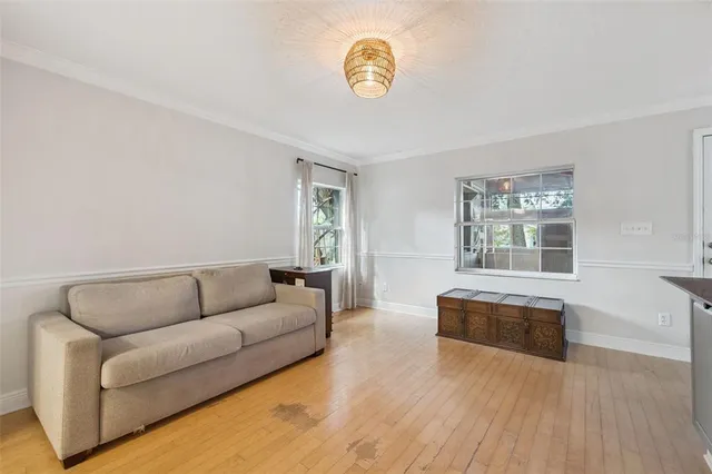 a living room with furniture and a window