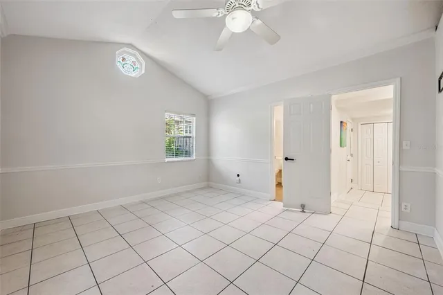 a bathroom with a toilet sink mirror and shower