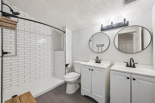 a bathroom with a sink a toilet and a bathtub