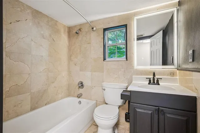 a view of a room with wooden floor and window