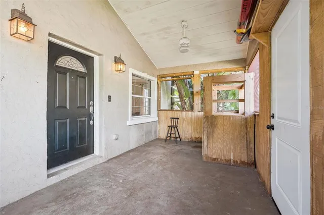 an aerial view of a residential houses with outdoor space and street view
