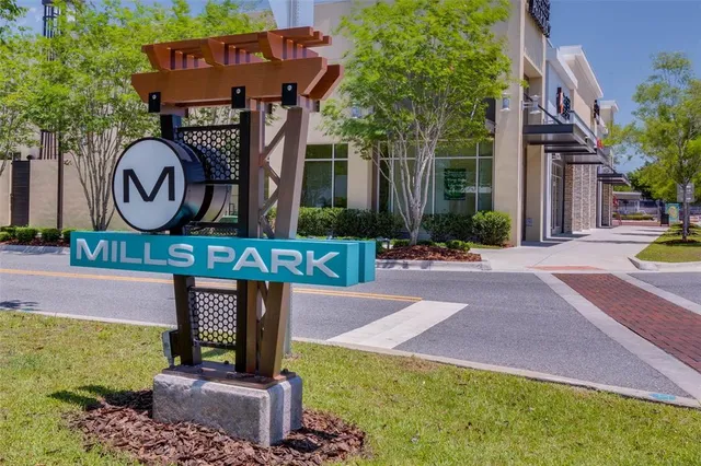 a view of a building with a tree in front
